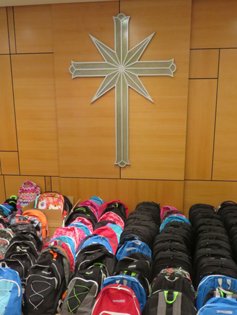 Fifty backpacks, ready to be delivered to Mary’s Place, a leading voice for local homeless women, children, and families in emergency situations. 