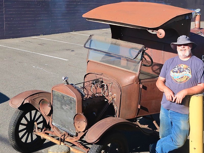 A vintage Model-T Ford truck converted to a barbeque pit grilled and served hamburgers and hot dogs to those attending National Night Out at the Seattle Church of Scientology