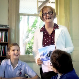 Sydney Scientologist Fiona Milne with kids in class