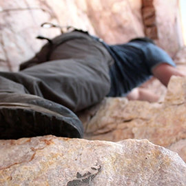 Low angle shot of Scientologist Dallas Hunter rock climbing