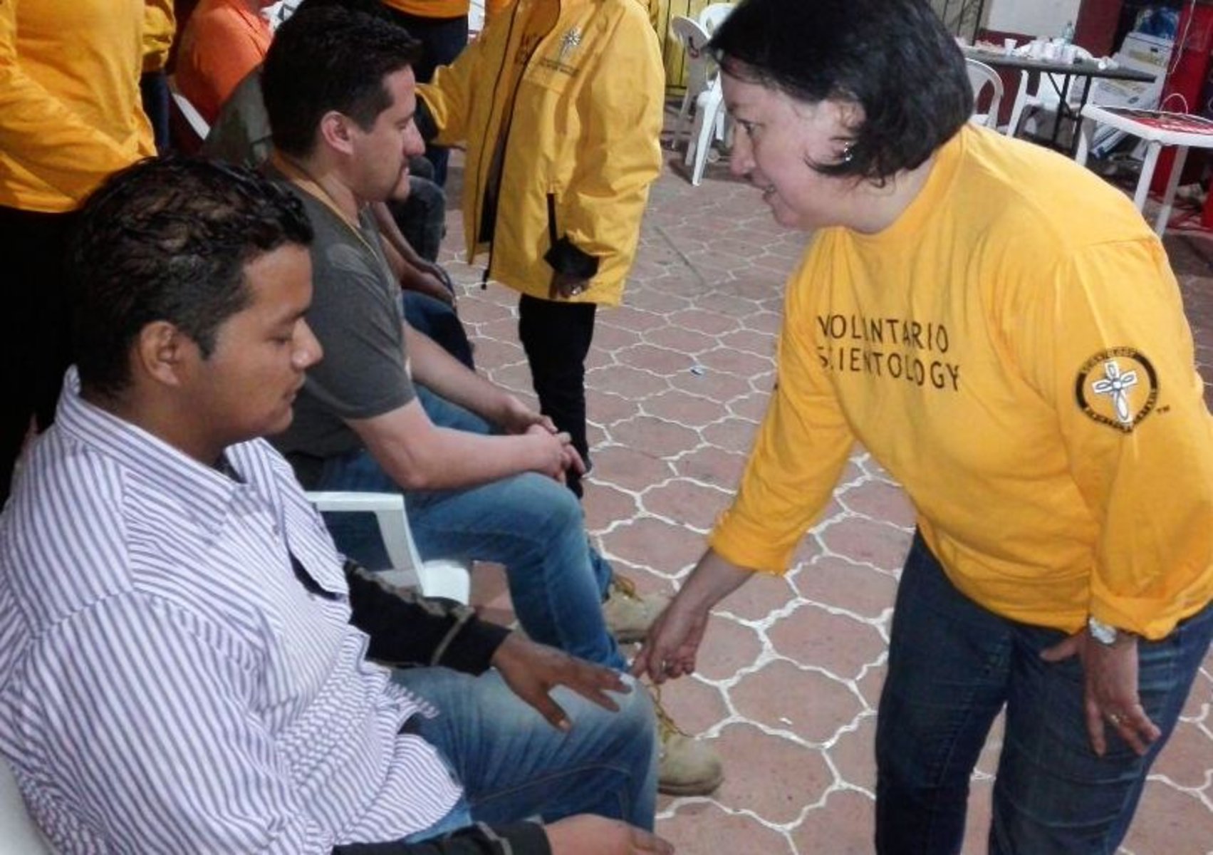 A Volunteer Minister provides relief using a Scientology assist to reduce pain, stress and trauma