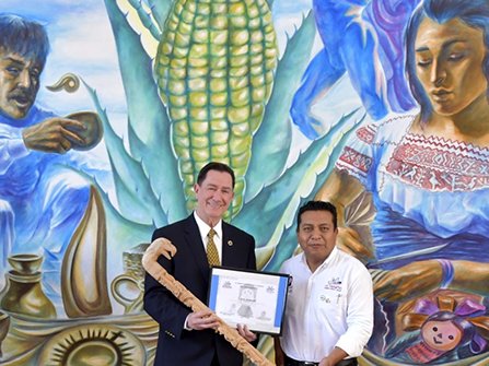 Mayor Sachez presents a scepter to a representative pf the Church of Scientology who accepts it on behalf of Scientology Founder L. Ron Hubbard.