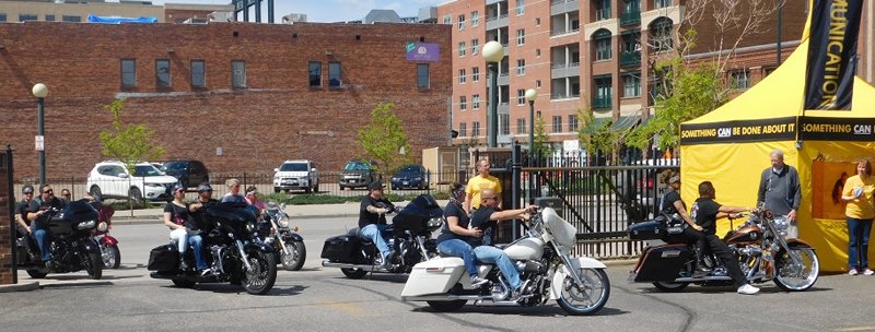 Denver’s Chicano Pride Ride pulls in to the parking lot of the Church of Scientology