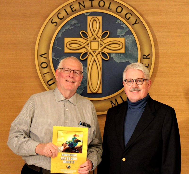 Washington VOAD president Marty Grishom (left) and a Volunteer Minister at a World Civil Defense Day open house and forum at the Church of Scientology Seattle