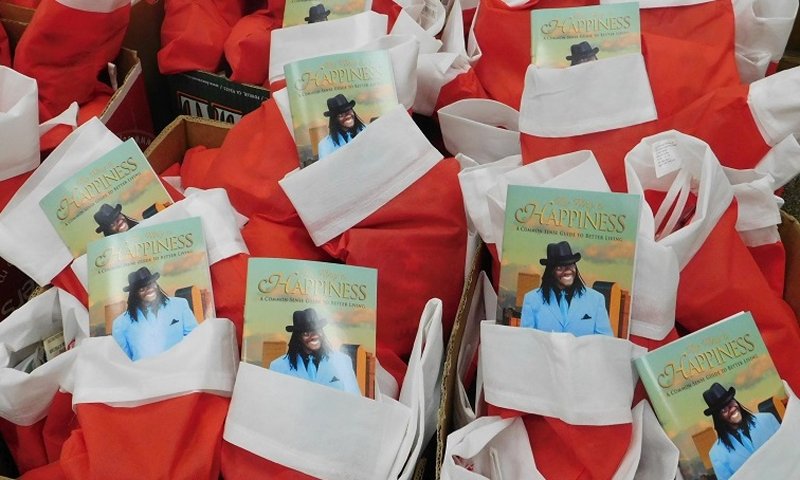 Christmas stockings with a copy of The Way to Happiness