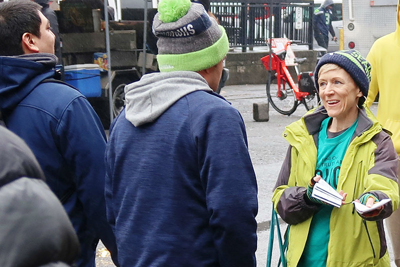 Handing out of drug education booklets at the Seattle Seahawks home game