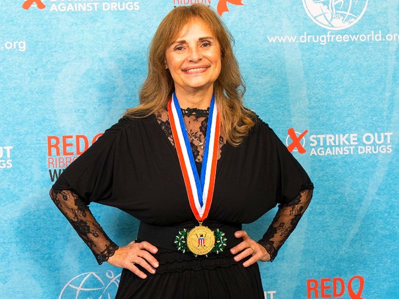 Anna Grace Zaucha with the prestigious Gold Medal Presidential Volunteer Award